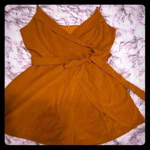 Romper with a belt that ties in front